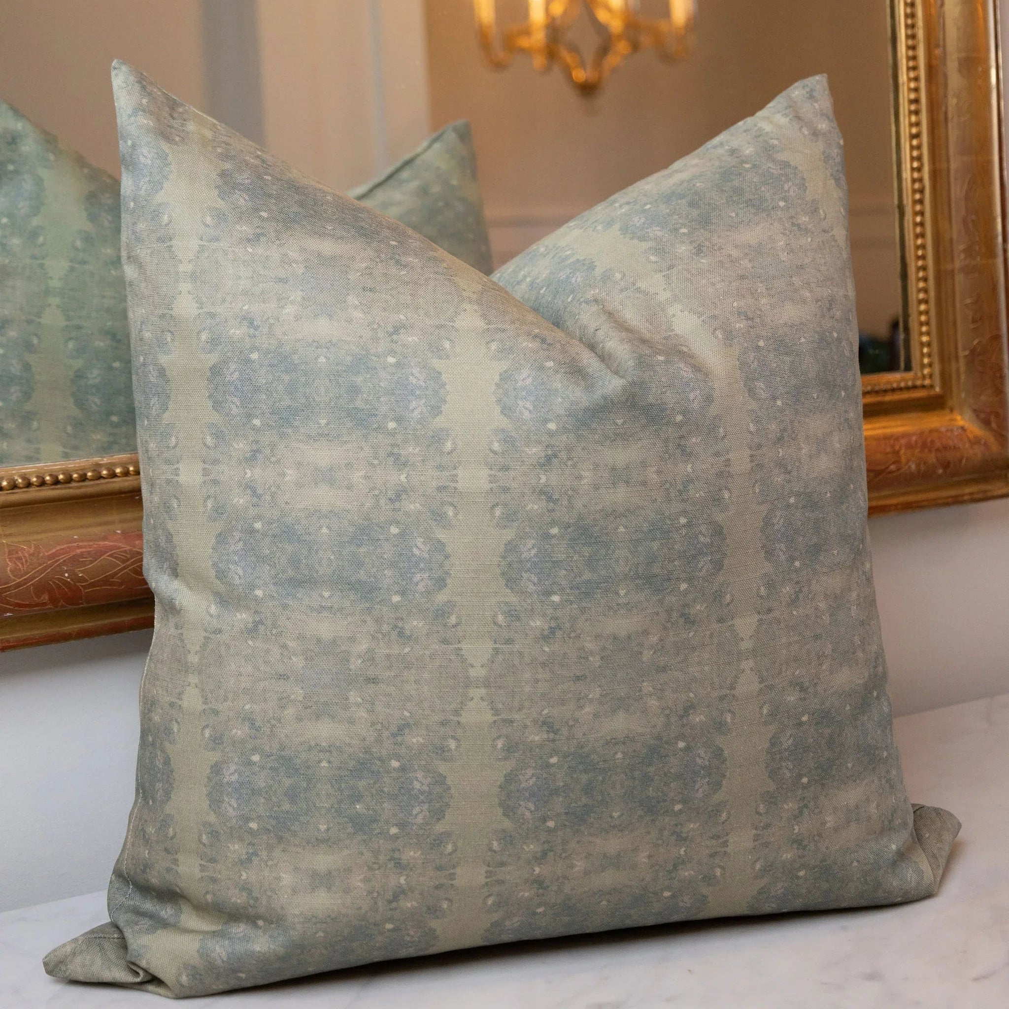 Centerpiece Rosemary luxury pillow featuring an abstract floral pattern in soft green tones, handcrafted in England for layered living rooms, bedrooms, and designer-curated interiors.