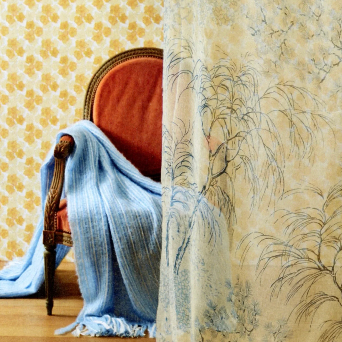 Luxury yellow floral wallpaper featuring the Trois Fleurs pattern, a non-directional botanical design ideal for walls, ceilings, breakfast rooms, powder rooms, and modern traditional interiors.