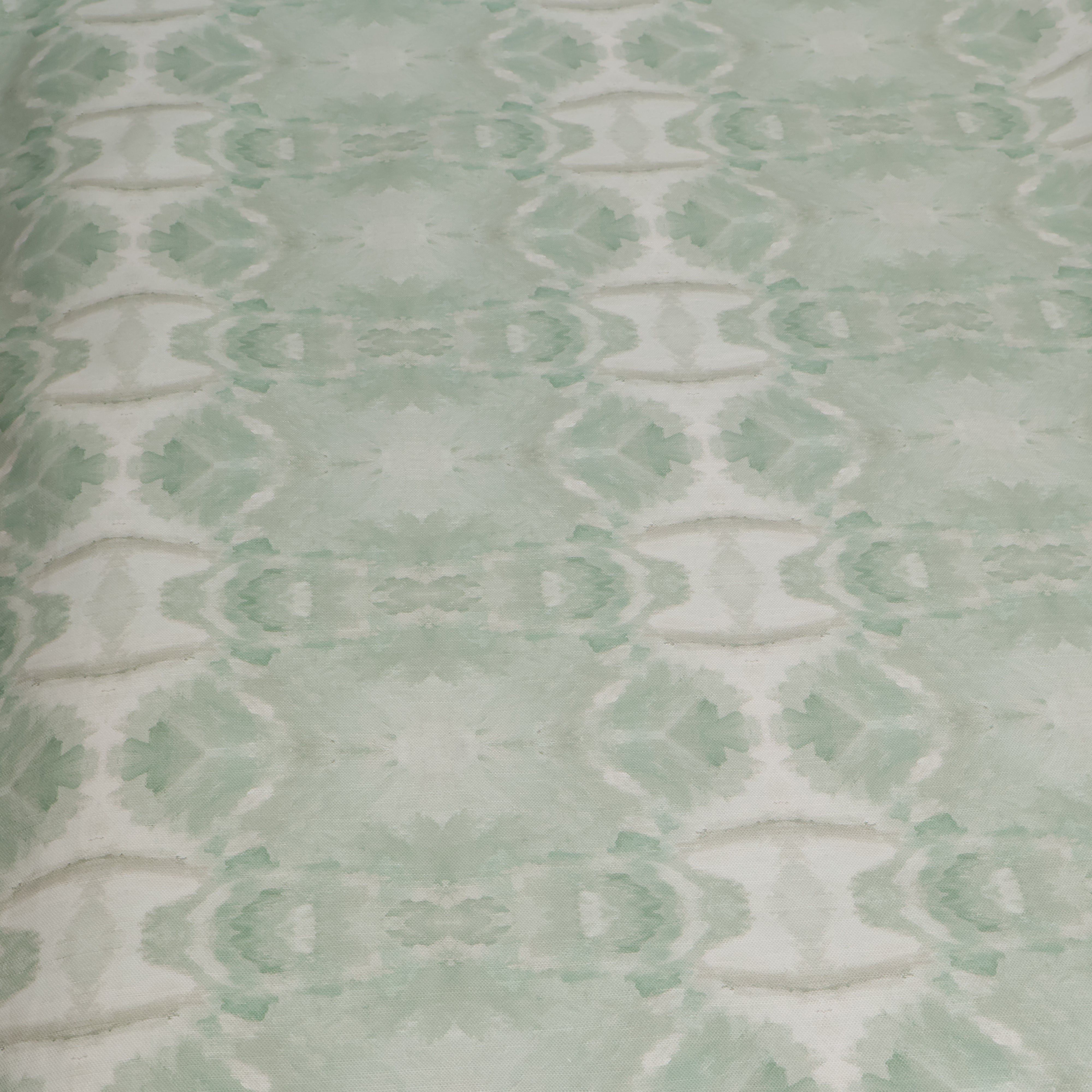 Luxury abstract botanical fabric featuring layered tree-inspired movement in calming jade green and soft neutral tones for collected modern traditional interiors.