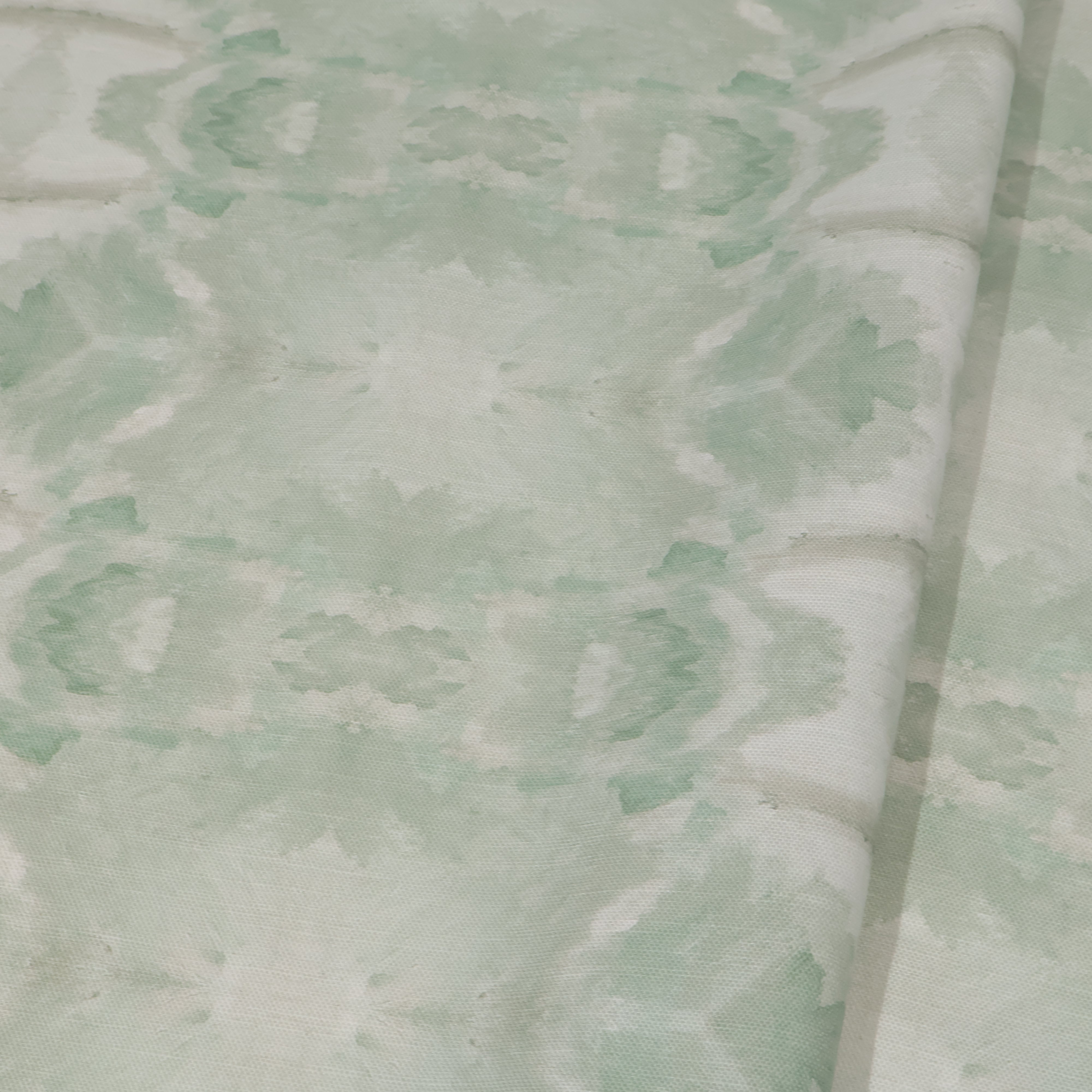 Luxury abstract botanical fabric featuring layered tree-inspired movement in calming jade green and soft neutral tones for collected modern traditional interiors.