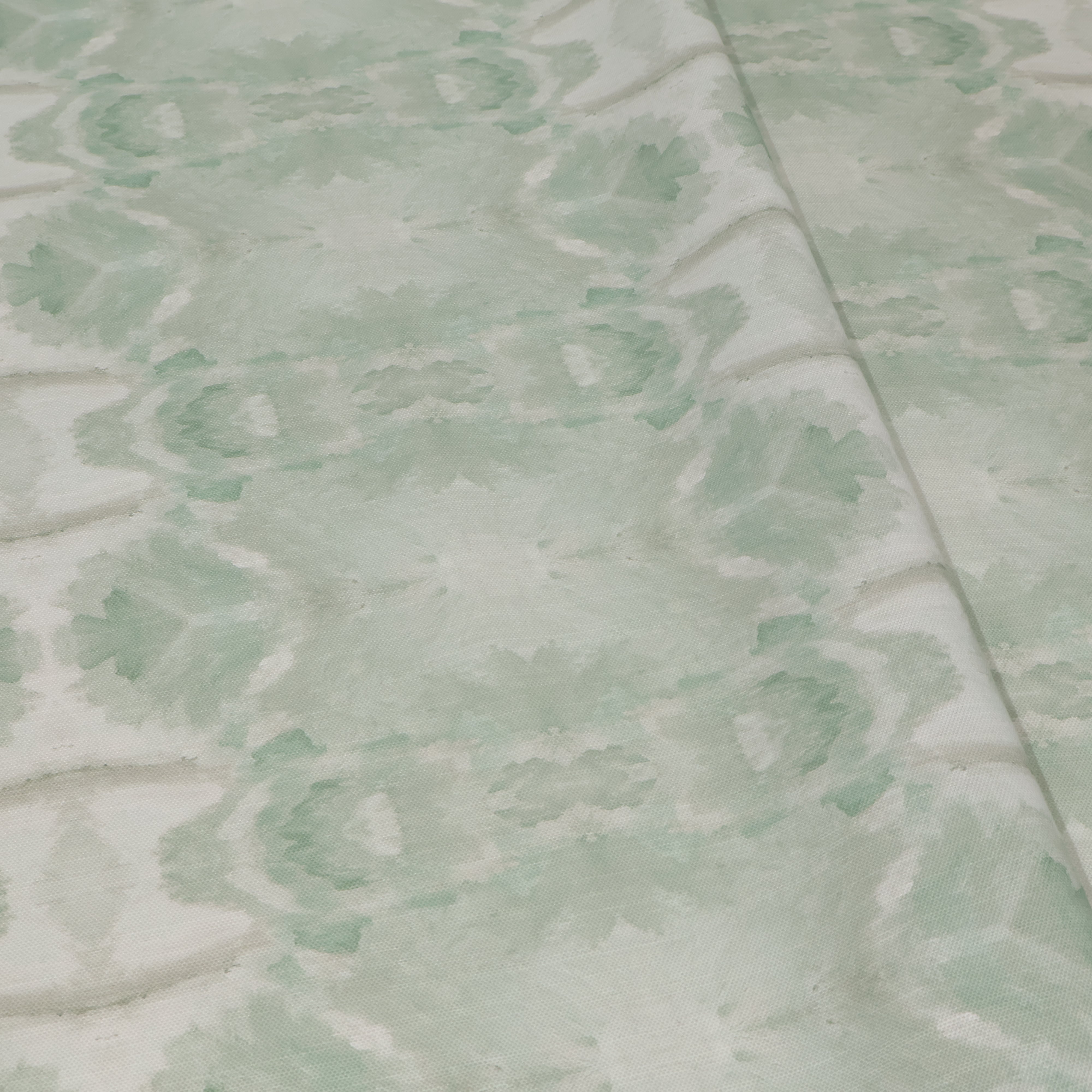Luxury abstract botanical fabric featuring layered tree-inspired movement in calming jade green and soft neutral tones for collected modern traditional interiors.
