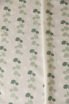 Luxury linear floral fabric with elegant dahlia vine pattern inspired by English gardens, ideal for drapery, upholstery, and refined layered interiors.