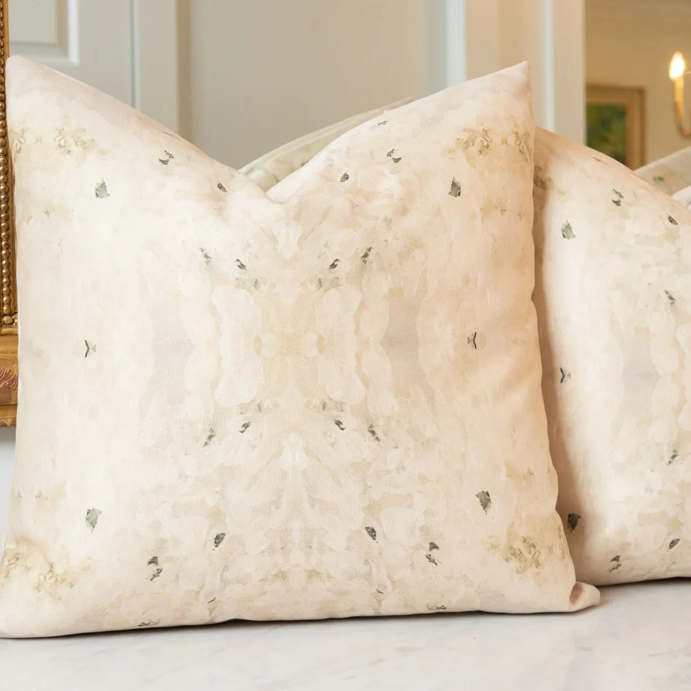 Centerpiece White Hydrangea luxury decorative pillow featuring a large-scale abstract floral pattern in layered white, cream, and deep olive green tones, handcrafted in England for luxury living rooms, designer-curated interiors, tailored upholstery, and thoughtfully layered homes.